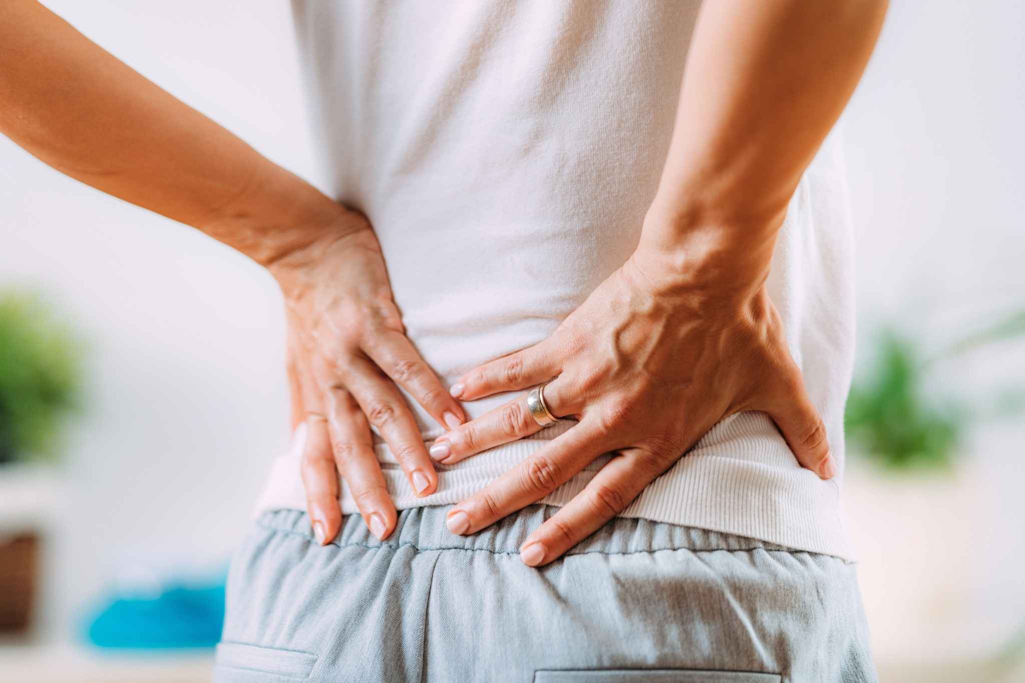 Sciatica Pain Relief in Vero Beach 1 Person experiencing lower back pain associated with sciatica.