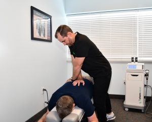 Lower Back Pain in Vero Beach FL 1 Dr. Bryan Wells, D.C. performing a spinal adjustment on a patient at Florida Spine Chiropractic, Vero Beach